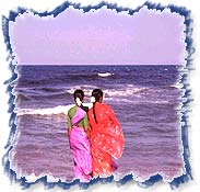 India Madras Chennai Girls in bright saris on beach
